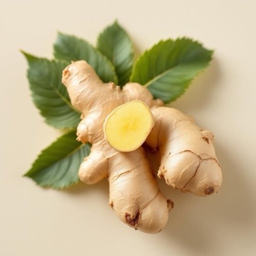 Fresh ginger rhizome with sliced pieces showing yellow interior